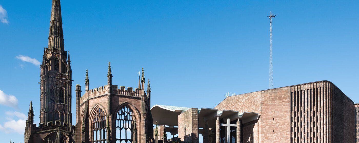 The ruined spire of the old St Michael's Cathedral in Coventry beside the 1960s cathedral built next to it